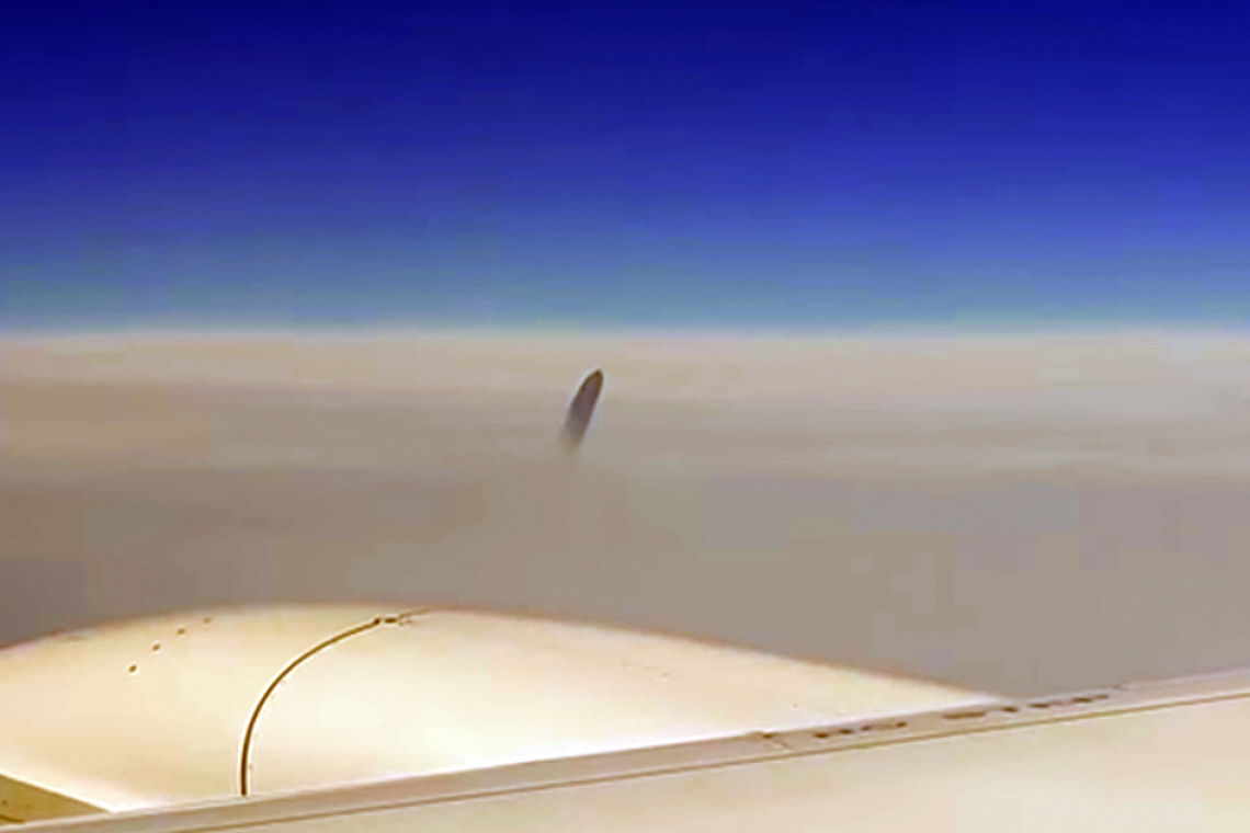 Mysterious UFO Was Seen Right Above The Clouds - Airline Passengers Filmed Outside the Window and Freaked out